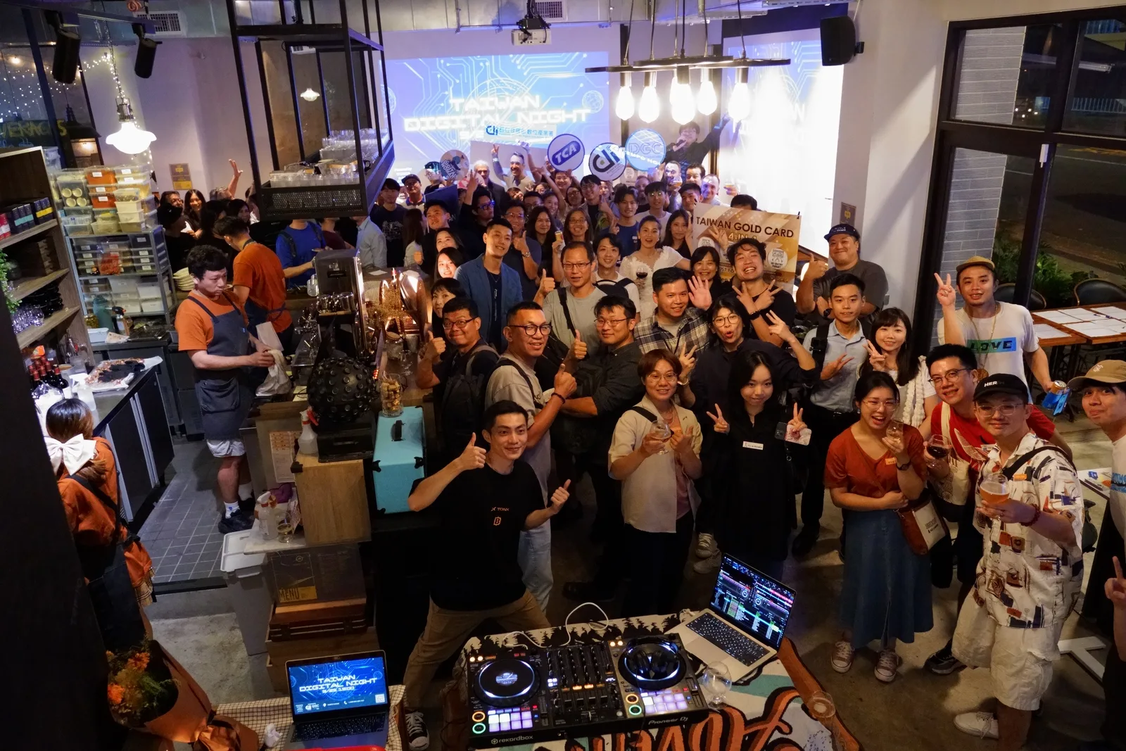 The whole room waves at the camera at the first Taiwan Digital Night in Taipei
